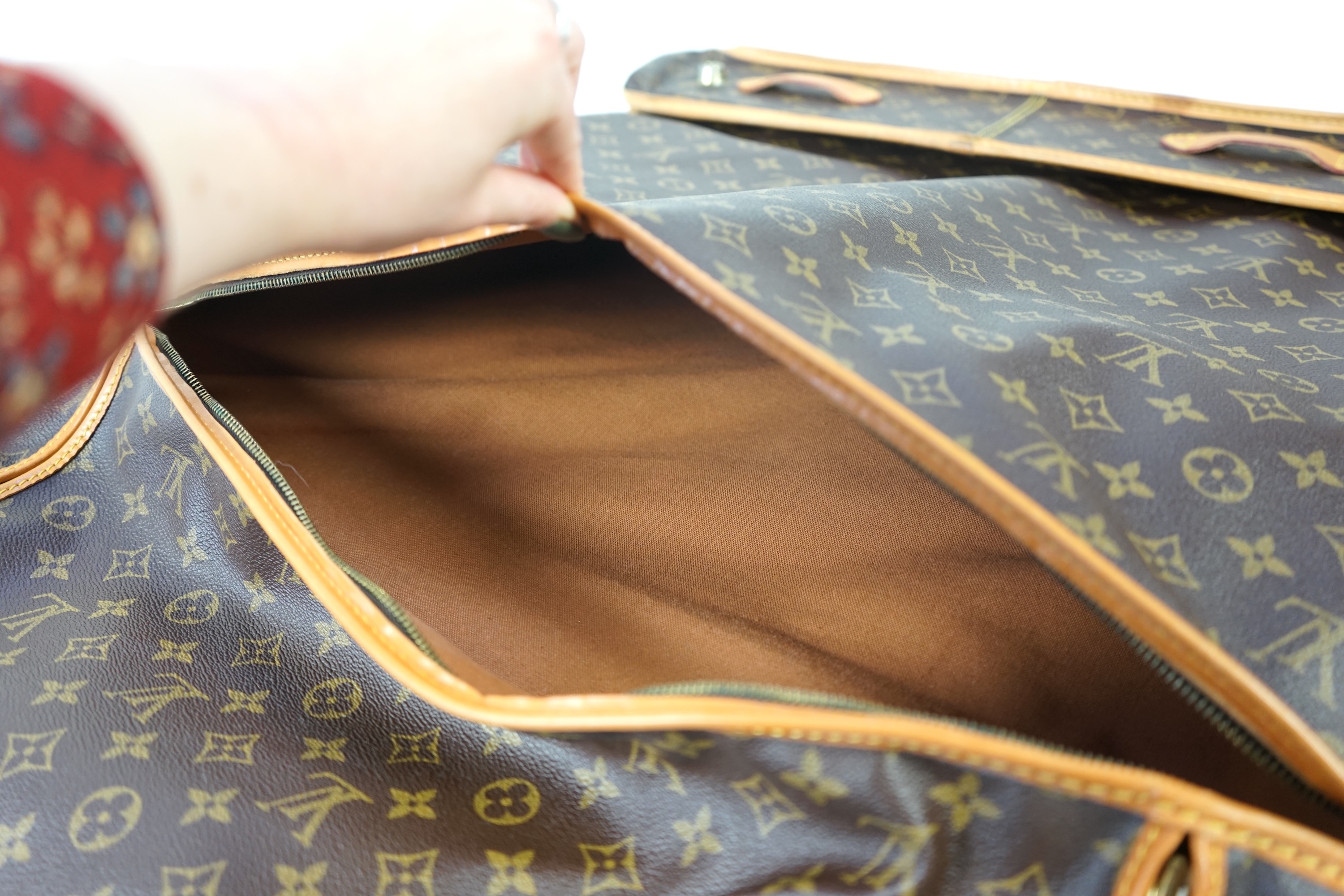 A Louis Vuitton monogram canvas and leather travel bag, 60cm x 53cm x 20cm closed